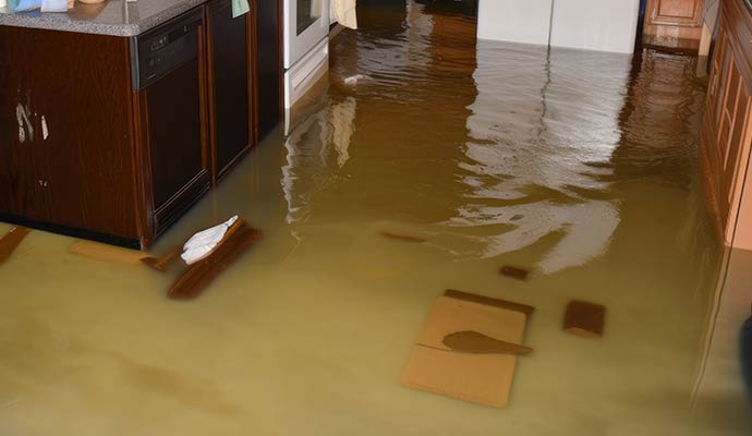 Flooded kitchen with standing water after storm