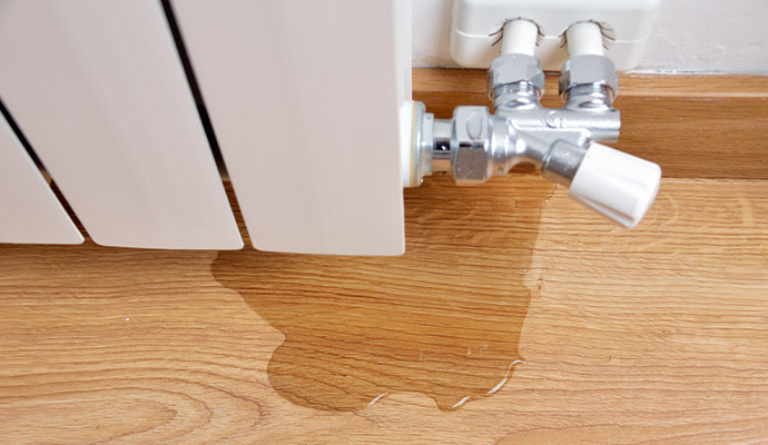 Leaking radiator valve causing floor water damage
