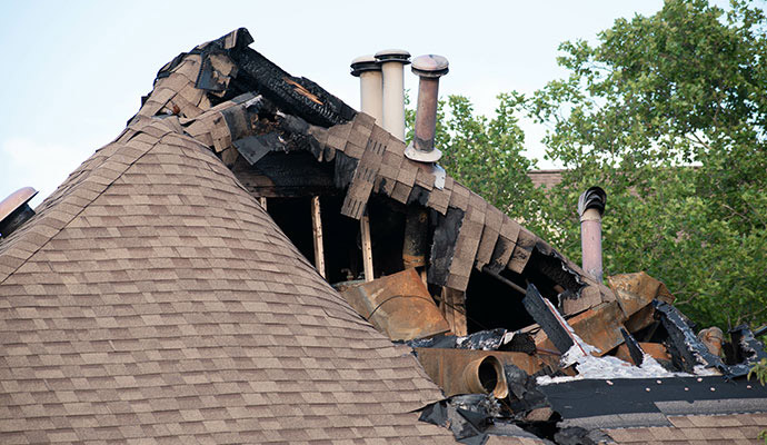 Severe fire damage causing roof exposed structure