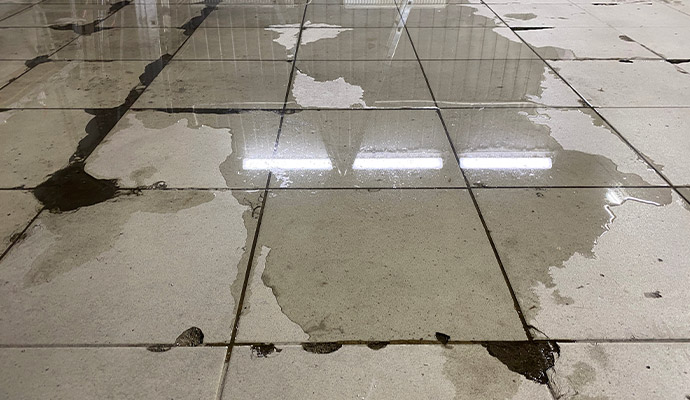 Standing water on tiled floor