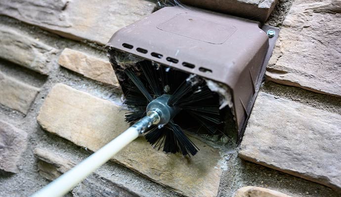 Dryer vent cleaning service using brush