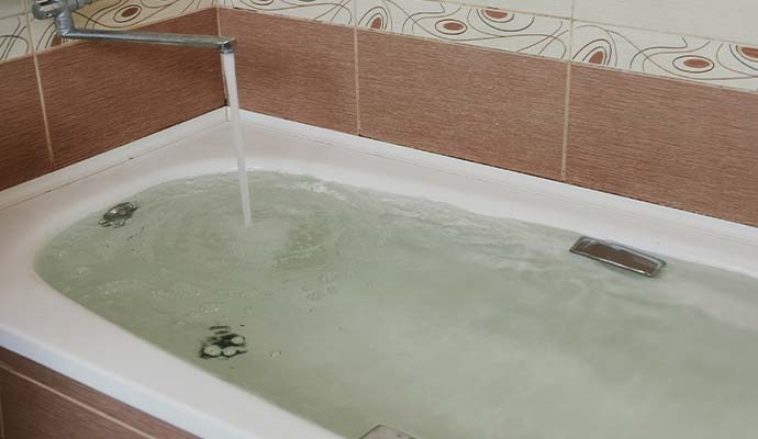 Overflowing bathtub filled with water