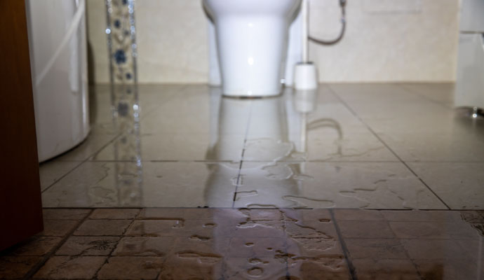Flooded bathroom floor tile