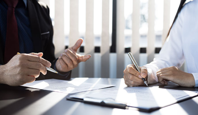 Two experts discussing about property damage insurance claim