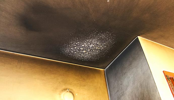 Smoke and soot damaged ceiling corner