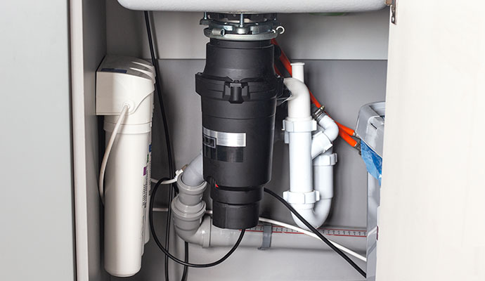 Garbage disposal unit and water filtration system under sink