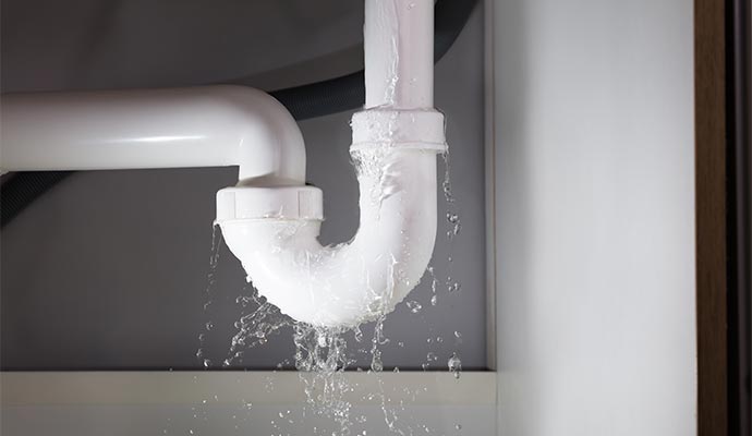 Plastic P-trap sink pipe leaking water