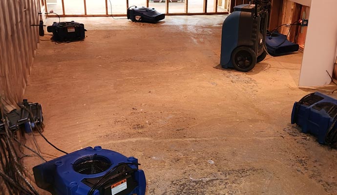 Restoring water damaged room with equipment