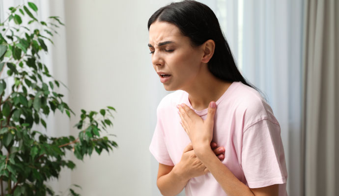 Woman experiencing breathing problem